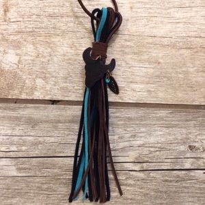 Tooled leather bull skull suede tassel